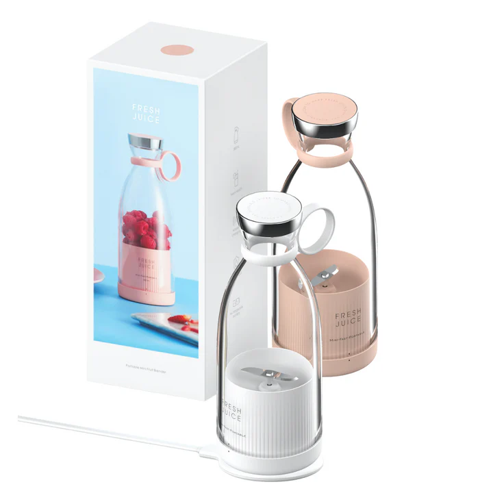 Max Portable Blender mit grünen und rosa Smoothies.